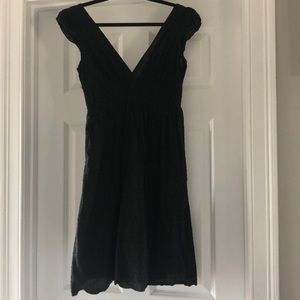 Black romantic low-v cap sleeve dress with dot detail